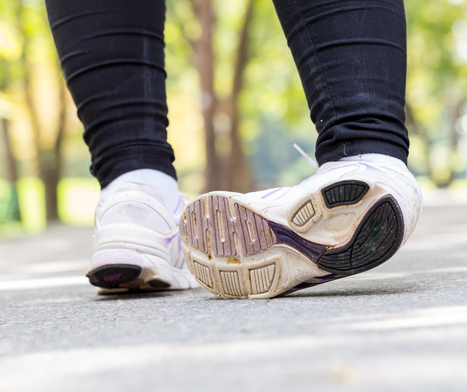 someone in running sneakers spraining their ankle