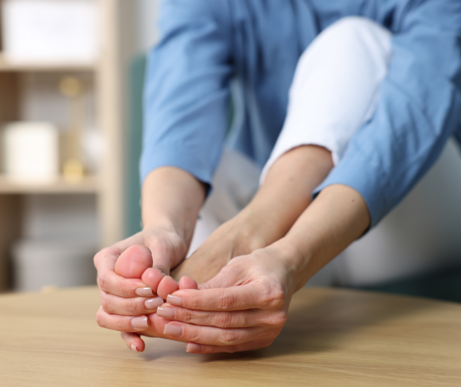 woman massaging toes